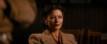 Movie still from “Dad's Army” (2016), directed by Oliver Parker – A person wearing a suit and tie; Close Up shot, Over the shoulder angle