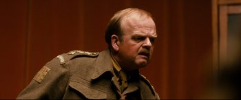 Movie still from “Dad's Army” (2016), directed by Oliver Parker – A man in a military uniform looking at the camera; Close Up shot, Low angle