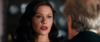 Movie still from “Dad's Army” (2016), directed by Oliver Parker – A person wearing a red dress; Close Up shot, Over the shoulder angle