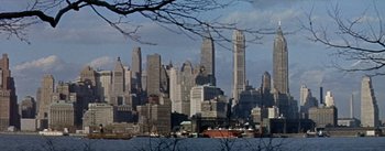 Movie still from “Daddy Long Legs” (1955), directed by Jean Negulesco – A view of a large city from across the water; Extreme Wide shot, High angle