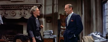 Movie still from “Daddy Long Legs” (1955), directed by Jean Negulesco – An older man and a younger woman talking in a room; Medium shot, Over the shoulder angle