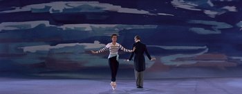 Movie still from “Daddy Long Legs” (1955), directed by Jean Negulesco – A man and a woman are dancing on a stage; Wide shot, Low angle