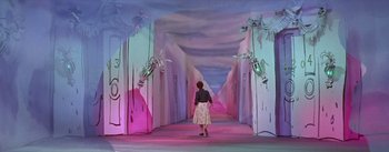 Movie still from “Daddy Long Legs” (1955), directed by Jean Negulesco – A woman walking down a long hallway in a room with pink walls; Wide shot, High angle