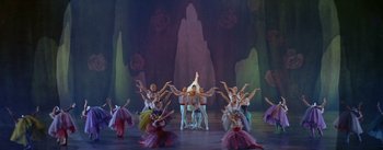 Movie still from “Daddy Long Legs” (1955), directed by Jean Negulesco – A group of people are dancing on stage; Wide shot, High angle