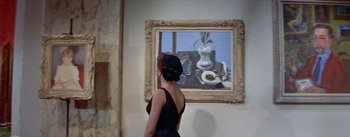 Movie still from “Daddy Long Legs” (1955), directed by Jean Negulesco – A woman standing in front of a painting; Medium shot, Low angle