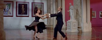 Movie still from “Daddy Long Legs” (1955), directed by Jean Negulesco – A man and a woman dancing in a room; Wide shot, Low angle
