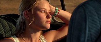 Movie still from “The Hills Have Eyes” (2006), directed by Alexandre Aja – A beautiful young woman sitting in a car; Close Up shot, Low angle