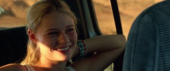 Movie still from “The Hills Have Eyes” (2006), directed by Alexandre Aja – A woman sitting in the back seat of a car; Close Up shot, Over the shoulder angle
