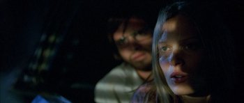 Movie still from “The Hills Have Eyes” (2006), directed by Alexandre Aja – A man and a woman are looking at the camera; Close Up shot, Low angle