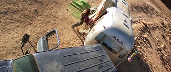 Movie still from “The Hills Have Eyes” (2006), directed by Alexandre Aja – An aerial view of an airplane parked on the ground; Extreme Wide shot, Overhead angle