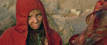Movie still from “The Hills Have Eyes” (2006), directed by Alexandre Aja – A woman in a red hooded jacket looking at the camera; Close Up shot, High angle