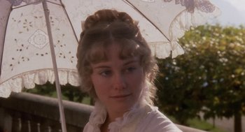 Movie still from “Daisy Miller” (1974), directed by Peter Bogdanovich – A woman in a white shirt holding an umbrella; Close Up shot, Over the shoulder angle