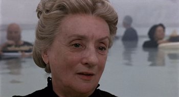 Movie still from “Daisy Miller” (1974), directed by Peter Bogdanovich – An older woman is looking into the distance; Close Up shot, Over the shoulder angle