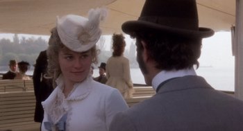 Movie still from “Daisy Miller” (1974), directed by Peter Bogdanovich – A man and a woman in a white dress and hat; Close Up shot, Over the shoulder angle