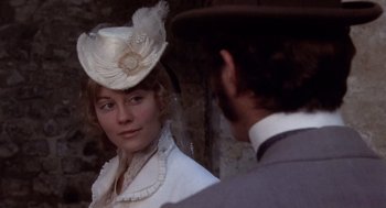 Movie still from “Daisy Miller” (1974), directed by Peter Bogdanovich – A man and a woman in a white dress and hat; Close Up shot, Over the shoulder angle