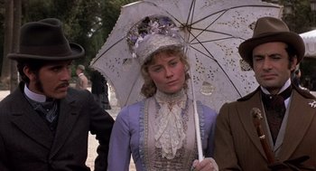 Movie still from “Daisy Miller” (1974), directed by Peter Bogdanovich – A woman in a victorian dress holding an umbrella; Close Up shot, Low angle