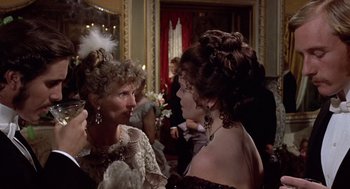 Movie still from “Daisy Miller” (1974), directed by Peter Bogdanovich – Two women are dressed up and talking to each other; Close Up shot, Over the shoulder angle