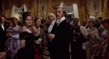 Movie still from “Daisy Miller” (1974), directed by Peter Bogdanovich – A group of people standing in a room; Medium shot, Low angle