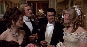 Movie still from “Daisy Miller” (1974), directed by Peter Bogdanovich – A group of people standing in a room; Medium shot, Low angle