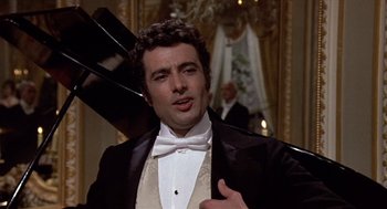 Movie still from “Daisy Miller” (1974), directed by Peter Bogdanovich – A man in a tuxedo standing in front of a mirror; Close Up shot, Low angle