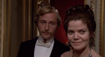 Movie still from “Daisy Miller” (1974), directed by Peter Bogdanovich – A man and a woman dressed in formal wear; Close Up shot, Low angle