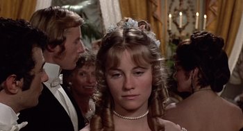 Movie still from “Daisy Miller” (1974), directed by Peter Bogdanovich – A young woman with long hair wearing a tiara; Close Up shot, Over the shoulder angle
