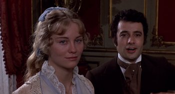 Movie still from “Daisy Miller” (1974), directed by Peter Bogdanovich – A man and a woman standing next to each other in a room; Close Up shot, Over the shoulder angle