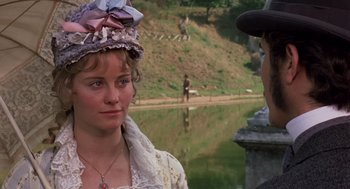 Movie still from “Daisy Miller” (1974), directed by Peter Bogdanovich – A woman wearing a hat standing next to a man; Close Up shot, Over the shoulder angle