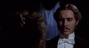 Movie still from “Daisy Miller” (1974), directed by Peter Bogdanovich – A person wearing a suit and bow tie; Close Up shot, Low angle