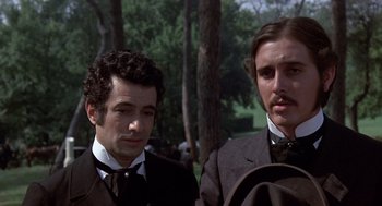 Movie still from “Daisy Miller” (1974), directed by Peter Bogdanovich – Two men in suits and ties standing next to each other; Close Up shot, Low angle