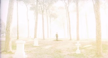 Movie still from “Daisy Miller” (1974), directed by Peter Bogdanovich – A man standing in the middle of a foggy forest; Extreme Wide shot, Low angle