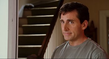 Movie still from “Dan in Real Life” (2007), directed by Peter Hedges – A person sitting in front of a staircase; Close Up shot, Over the shoulder angle