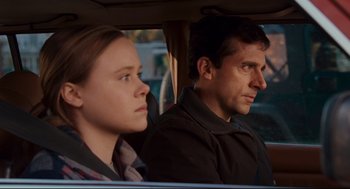 Movie still from “Dan in Real Life” (2007), directed by Peter Hedges – A man and a woman sitting in the back of a car; Close Up shot, Over the shoulder angle