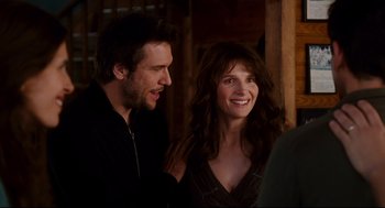 Movie still from “Dan in Real Life” (2007), directed by Peter Hedges – A man and a woman smiling for the camera; Close Up shot, Over the shoulder angle
