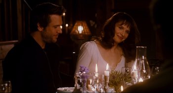 Movie still from “Dan in Real Life” (2007), directed by Peter Hedges – A man and a woman sitting at a dinner table; Medium shot, Over the shoulder angle