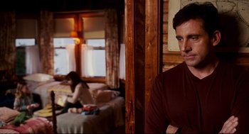 Movie still from “Dan in Real Life” (2007), directed by Peter Hedges – A man and a woman sitting in front of each other in a room; Medium shot, Over the shoulder angle