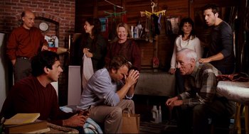 Movie still from “Dan in Real Life” (2007), directed by Peter Hedges – A group of people sitting around a living room together; Medium shot, High angle