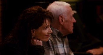 Movie still from “Dan in Real Life” (2007), directed by Peter Hedges – An older man and a younger woman sitting next to each other; Close Up shot, Over the shoulder angle