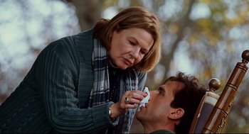 Movie still from “Dan in Real Life” (2007), directed by Peter Hedges – A woman putting a tissue on a mans face; Close Up shot, Low angle