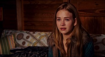 Movie still from “Dan in Real Life” (2007), directed by Peter Hedges – A young girl with long brown hair wearing a fur coat; Close Up shot, Over the shoulder angle