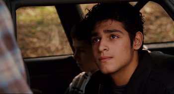 Movie still from “Dan in Real Life” (2007), directed by Peter Hedges – Two young men sitting in the back seat of a car; Close Up shot, Over the shoulder angle