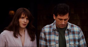 Movie still from “Dan in Real Life” (2007), directed by Peter Hedges – A man and a woman standing next to each other in front of a building; Medium shot, Over the shoulder angle