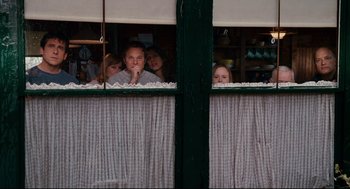 Movie still from “Dan in Real Life” (2007), directed by Peter Hedges – A group of people looking out of a window; Medium shot, Over the shoulder angle