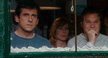 Movie still from “Dan in Real Life” (2007), directed by Peter Hedges – A man and two women looking out of a window; Medium shot, Low angle