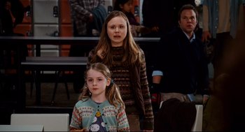 Movie still from “Dan in Real Life” (2007), directed by Peter Hedges – Two young girls standing next to each other in front of a crowd; Medium shot, Over the shoulder angle