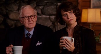 Movie still from “Dan in Real Life” (2007), directed by Peter Hedges – An older man and a younger woman holding a coffee mug; Medium shot, Over the shoulder angle