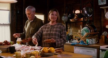 Movie still from “Dan in Real Life” (2007), directed by Peter Hedges – An older man and woman in a kitchen preparing food; Medium shot, Low angle