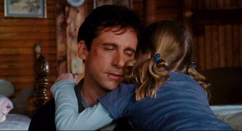 Movie still from “Dan in Real Life” (2007), directed by Peter Hedges – A man and a little girl hugging each other; Close Up shot, Over the shoulder angle