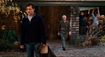 Movie still from “Dan in Real Life” (2007), directed by Peter Hedges – Two men walking down a path in front of a building; Medium shot, Over the shoulder angle