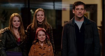 Movie still from “Dan in Real Life” (2007), directed by Peter Hedges – A group of people standing next to each other; Medium shot, Over the shoulder angle